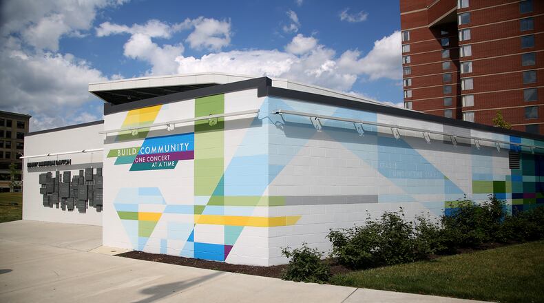 MixedA new mural, with poetry written by Sierra Leone,  has been completed at the Levitt Pavilion in Dayton. The poem, “Music Heals on Fifth and Main,” can be read in full on the north side of the building located east of the pavilion. The mural, a combination of bold shapes and bright colors, was designed by Brent Beck and executed by Atalie Gagnet, two local artists.   LISA POWELL / STAFF
