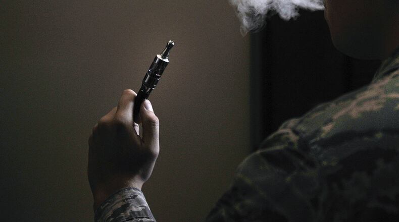 An Airman holds an electronic cigarette at Scott Air Force Base, Ill., Aug. 13, 2014. The Centers for Disease Control and Prevention is investigating the more than 2,000 cases of e-cigarette, or vaping, product use associated with lung injury that have occurred across the country. (U.S. Air Force photo/Airman 1st Class Erica Crossen)