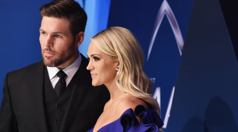 NASHVILLE, TN - NOVEMBER 08: (FOR EDITORIAL USE ONLY)  NHL player Mike Fisher and singer-songwriter Carrie Underwood attend the 51st annual CMA Awards at the Bridgestone Arena on November 8, 2017 in Nashville, Tennessee.  (Photo by Michael Loccisano/Getty Images)