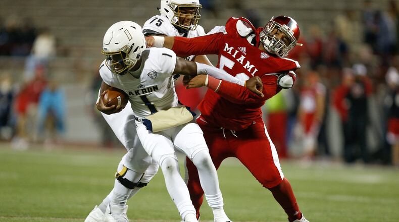 OXFORD, OH - NOVEMBER 07: Doug Costin #58 of the Miami Ohio Redhawks sacks Kato Nelson #1 of the Akron Zips during the second half at Yager Stadium on November 7, 2017 in Oxford, Ohio. (Photo by Michael Reaves/Getty Images)