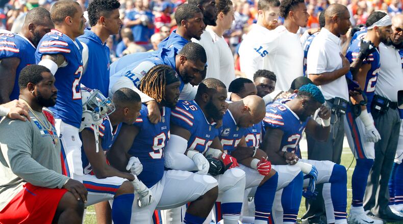 FILE - In this Sunday, Sept. 24, 2017, file photo, Buffalo Bills players take a knee during the playing of the national anthem prior to an NFL football game against the Denver Broncos in Orchard Park, N.Y. What began more than a year ago with a lone NFL quarterback protesting police brutality against minorities by kneeling silently during the national anthem before games has grown into a roar with hundreds of players sitting, kneeling, locking arms or remaining in locker rooms, their reasons for demonstrating as varied as their methods. (AP Photo/Jeffrey T. Barnes, File)