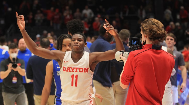 Dayton's Malachi Smith celebrates after a victory against Saint Louis on Tuesday, Jan. 11, 2022, at UD Arena. David Jablonski/Staff