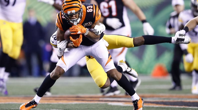 CINCINNATI, OH - DECEMBER 04: Tyler Boyd #83 of the Cincinnati Bengals is tackled by Sean Davis #28 of the Pittsburgh Steelers during the first half at Paul Brown Stadium on December 4, 2017 in Cincinnati, Ohio. (Photo by Andy Lyons/Getty Images)
