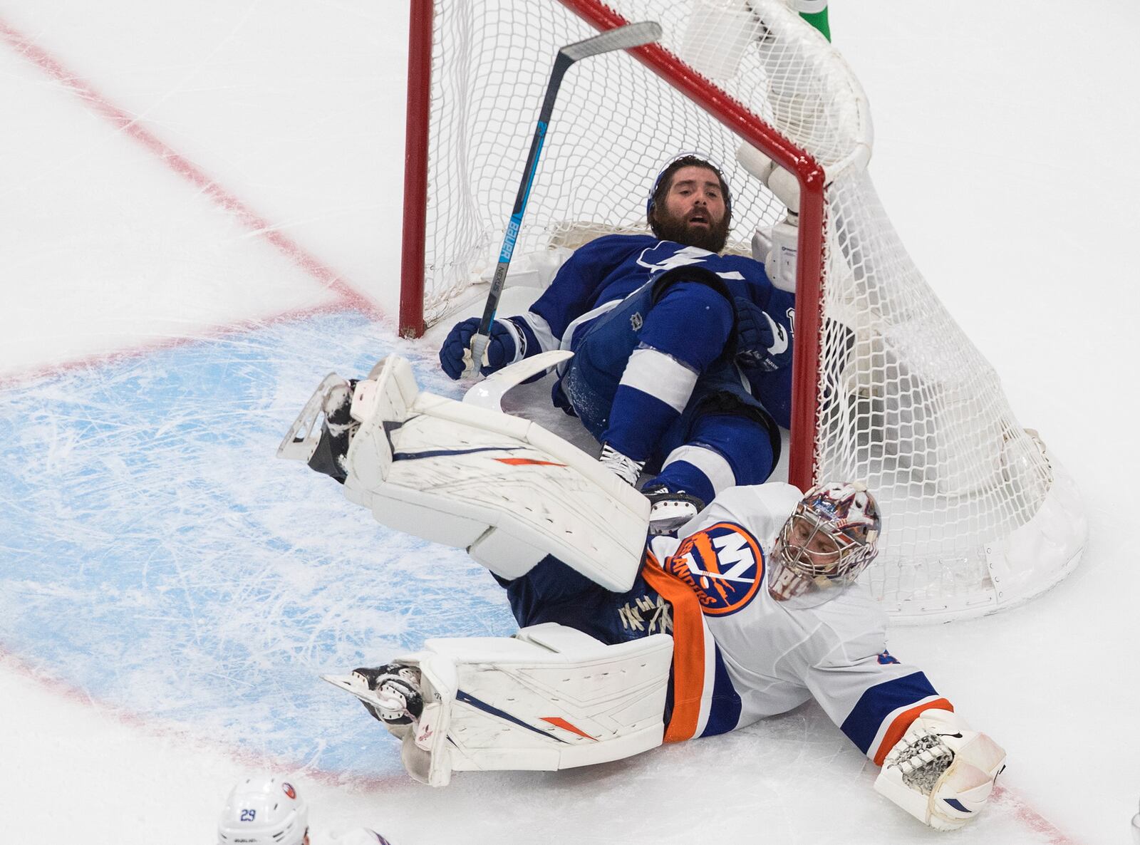 Tampa Bay Lightning's Pat Maroon crashes into New York Islanders goalie Semyon Varlamov (40) and the goal during the second period of Game 2 of the NHL hockey Eastern Conference final, Wednesday, Sept. 9, 2020, in Edmonton, Alberta. (Jason Franson/The Canadian Press via AP)