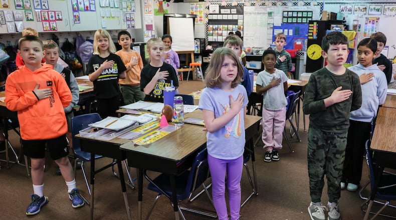 Second grade students in Missy Fairs' at Weller Elementary in Centerville recite the Pledge of Allegiance on Wednesday morning. A bill pending in the Ohio House would require public schools to pick a daily time to recite the pledge of allegiance. BRYANT BILLING / STAFF