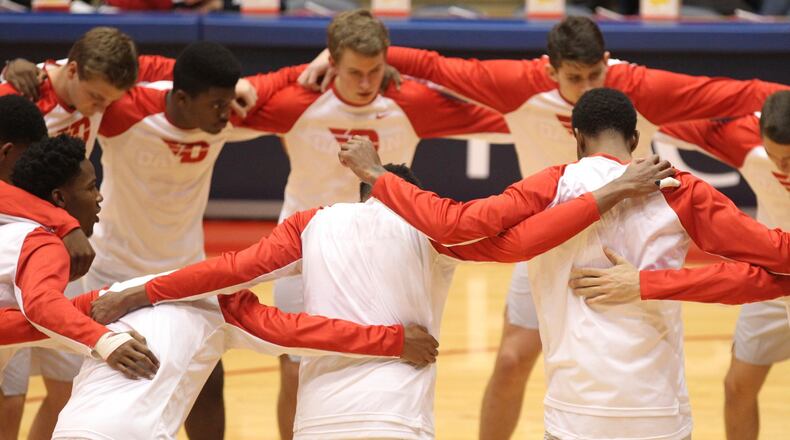 Dayton players huddle before a game against Austin Peay on Friday, Nov. 11, 2016, at UD Arena. David Jablonski/Staff