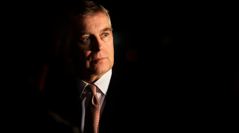 FILE - Britain's Prince Andrew looks on during an event at the residence of the British Ambassador in New Delhi, India, March 10, 2010. (AP Photo/Manish Swarup, File)