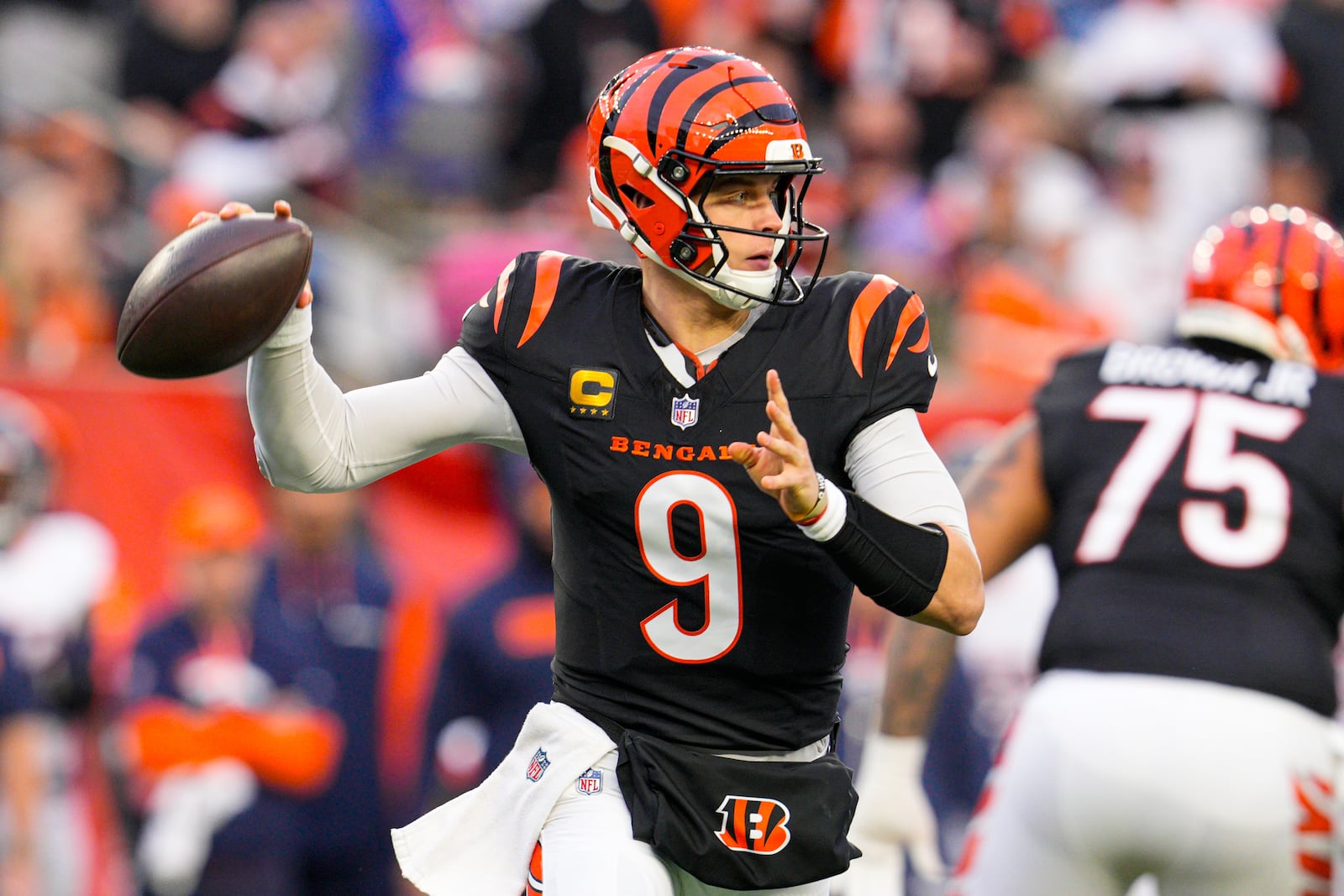 FILE - Cincinnati Bengals quarterback Joe Burrow (9) throws against the Denver Broncos during the first half of an NFL football game in Cincinnati, Saturday, Dec. 28, 2024. (AP Photo/Jeff Dean, File)