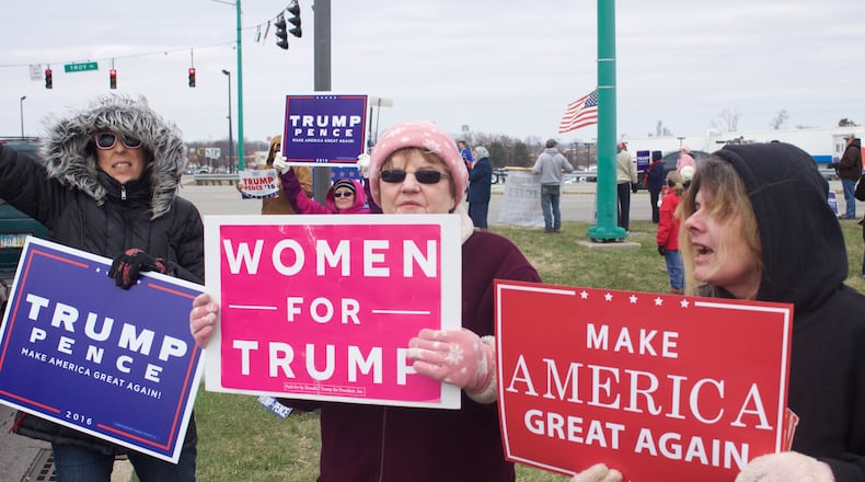 More than a dozen people showed up at the corner of State Route 41 and North Bechtle Avenue in Springfield on Saturday to show support for President Donald Trump and his policies. HASAN KARIM/STAFF