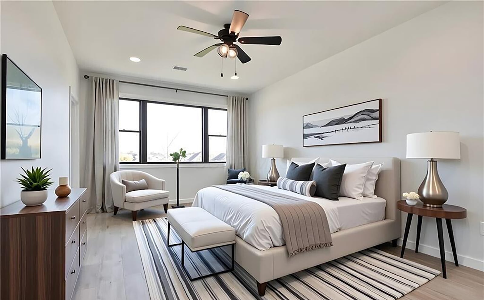 The first floor primary bedroom suite has LVP flooring, a ceiling fan, recessed lighting and an ensuite bathroom with a walk in shower and closet. CONTRIBUTED