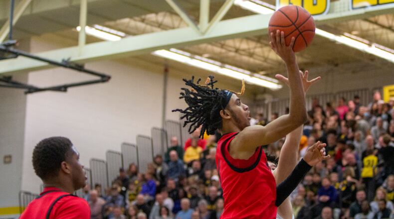 Wayne's Lawrent Rice shoots his familiar right-handed floater during a 25-point night earlier this season at Centerville. Rice leads the GWOC in scoring, rebounding and steals, and is second in assists. CONTRIBUTED/Jeff Gilbert