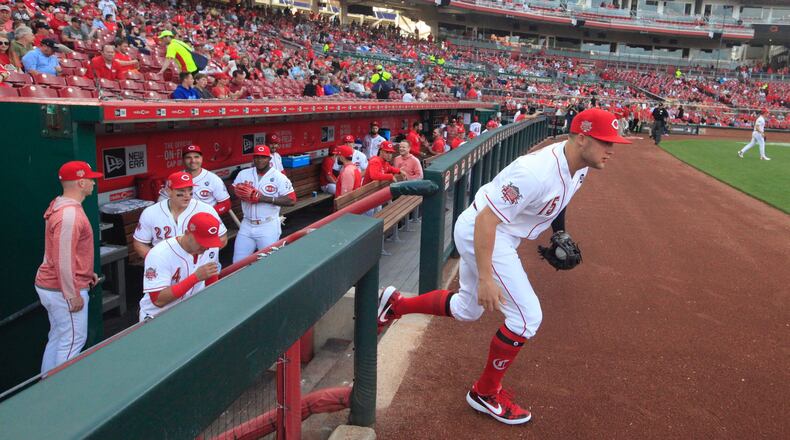 The Reds’ Nick Senzel takes the field in the first inning in his big-league debut against the Giants on Friday, May 3, 2019, at Great American Ball Park in Cincinnati. David Jablonski/Staff