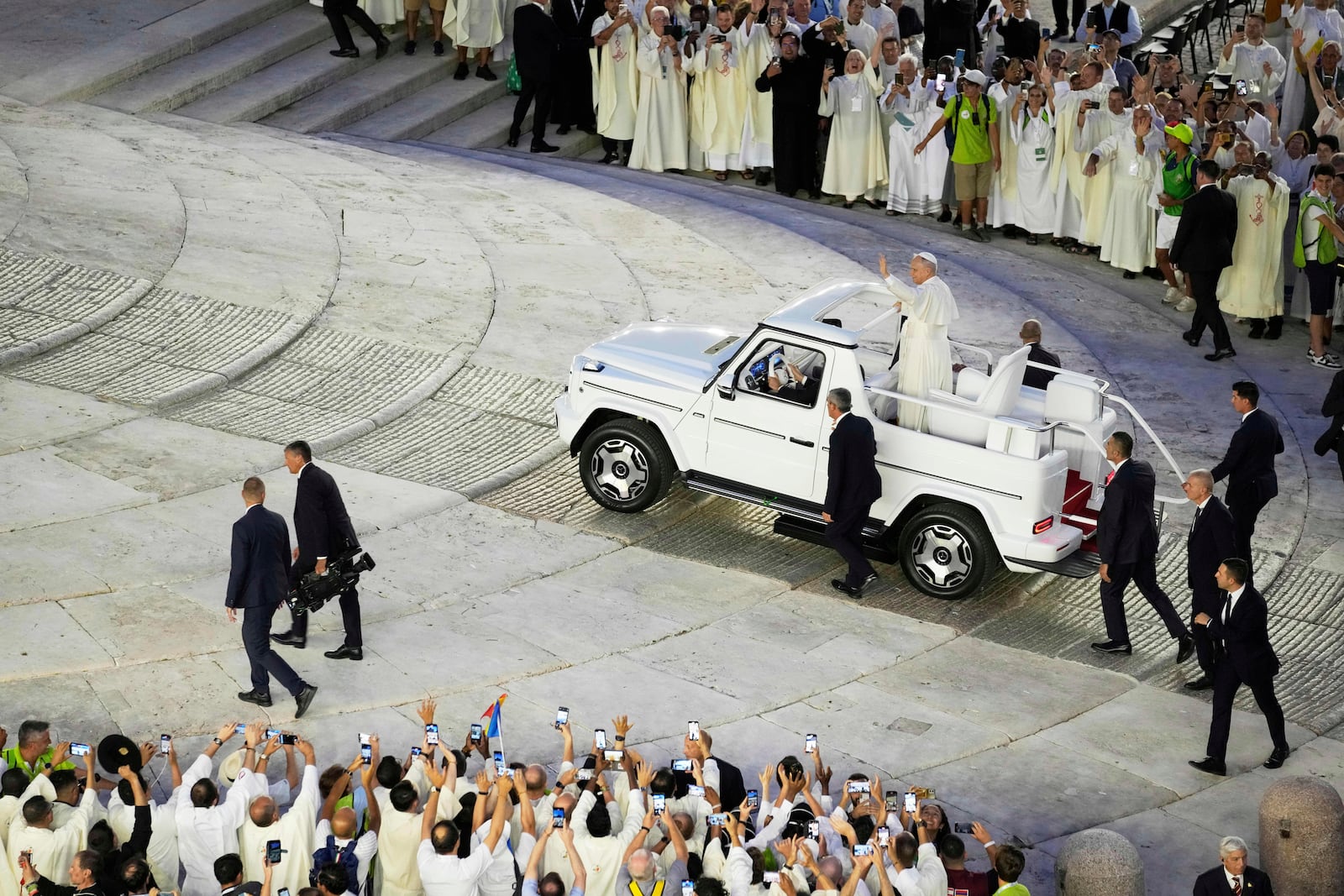Pope Leo XIV greets faithful in St. Peter's Square at the end of a welcome mass for the Youth Jubilee at the Vatican, Tuesday, July 29, 2025. (AP Photo/Gregorio Borgia)