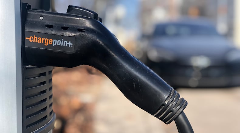 An electric vehicle charging station on North Patterson Boulevard in downtown Dayton. CORNELIUS FROLIK / STAFF