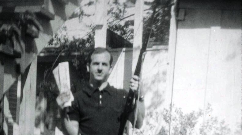 Lee Harvey Oswald, accused of assassinating former U.S. President John F. Kennedy, is pictured holding a rifle in this undated Dallas Police Department Archive image. This photo, described as showing Oswald "holding a rifle in one hand and Communist newspapers in the other" in the backyard of 214 W. Neely Street, is believed to have been taken by his wife Marina Oswald in 1963. The City of Dallas will hold commemoration ceremonies on November 22, 2013 marking the 50th anniversary of the assassination of President Kennedy. REUTERS/Dallas Police Department/Dallas Municipal Archives/University of North Texas/Handout