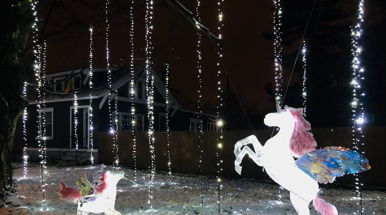 The Crofts’ holiday light display features 5 unicorns and around 4,000 lights hanging from the trees and covering the ground. CONTRIBUTED