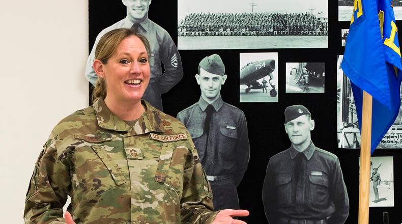 Chief Master Sgt. Lindsey Wolf, Air Force Materiel Command paralegal career field functional manager, delivers the keynote address to Airman Leadership School Class 22-B during its graduation ceremony Feb. 10 at Wright-Patterson Air Force Base. Wolf served as class mentor. U.S. AIR FORCE PHOTO/JAIMA FOGG