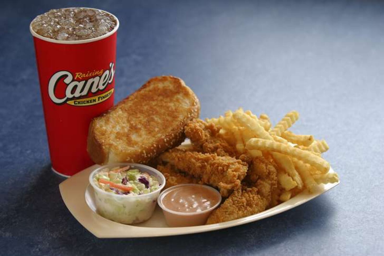 Raising Cane’s menu includes chicken fingers, crinkle-cut fries, cole slaw, Texas Toast and Cane’s Sauce. SUBMITTED