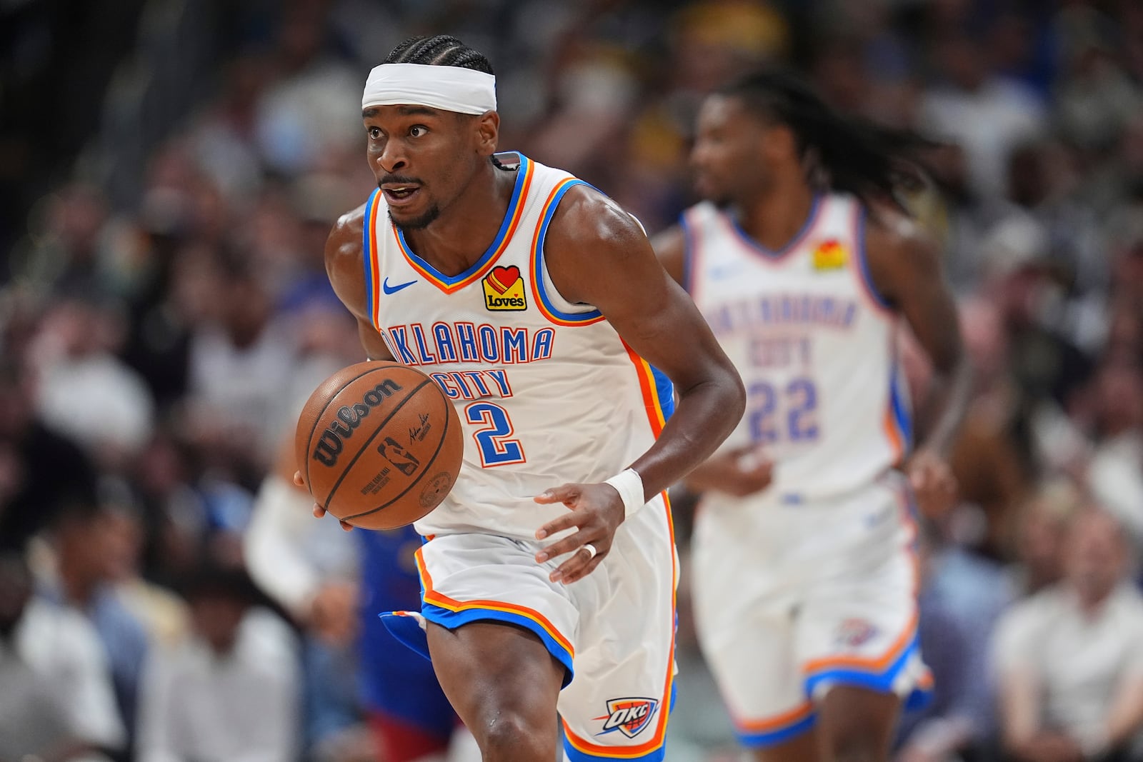 Oklahoma City Thunder guard Shai Gilgeous-Alexander collects a loose ball in the second half of Game 3 in the Western Conference semifinals of the NBA basketball playoffs against the Denver Nuggets, Friday, May 9, 2025, in Denver. (AP Photo/David Zalubowski)