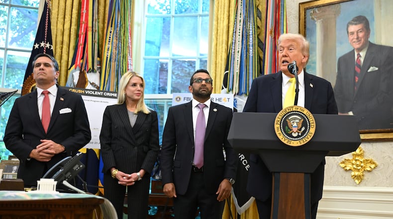 President Donald Trump speaks as FBI Director Kash Patel, Attorney General Pam Bondi, and Deputy Attorney General Todd Blanche listen during an event in the Oval Office at the White House, Wednesday, Oct. 15, 2025, in Washington. (AP Photo/John McDonnell)