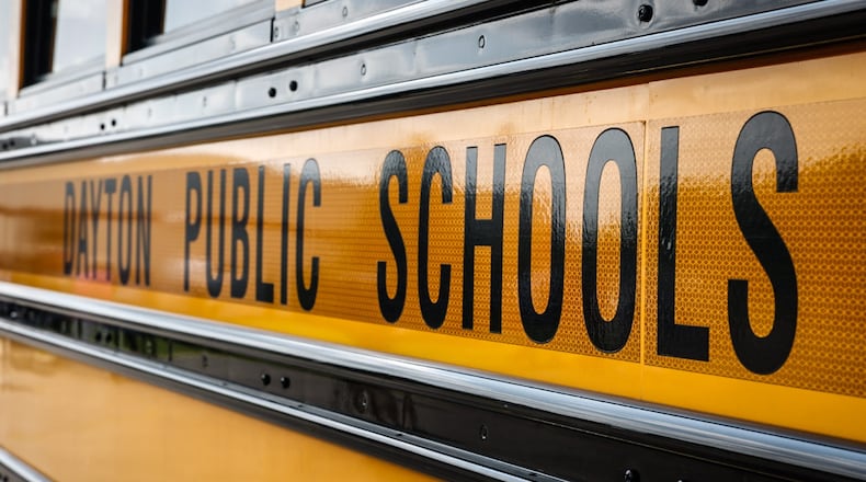 A Dayton Public School bus sits in the bus lot on James H. McGee Blvd. in Dayton. JIM NOELKER/STAFF