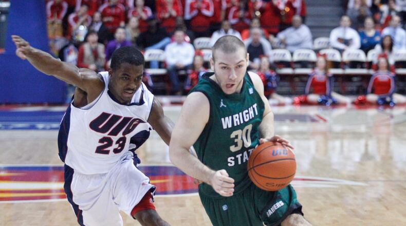 Joe Bramanti, of Wright State, is guarded by Illinois-Chicago’s Jay Parker on Tuesday, Feb. 26, 2013, at the UIC Pavilion in Chicago. David Jablonski/Staff Wright State’s Joe Bramanti is guarded by UIC’s Jay Parker. Wright State lost 60-55 to Illinois-Chicago at UIC Pavilion on Tuesday, Feb. 26, 2013, in Chicago.