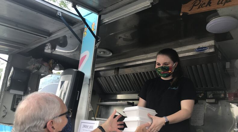 Don Mackos, president of RetireMEDiQ, buys lunch as part of a “Carryout for a Cause” fundraiser with El Meson to support the Alzheimer’s Association. KAITLIN SCHROEDER