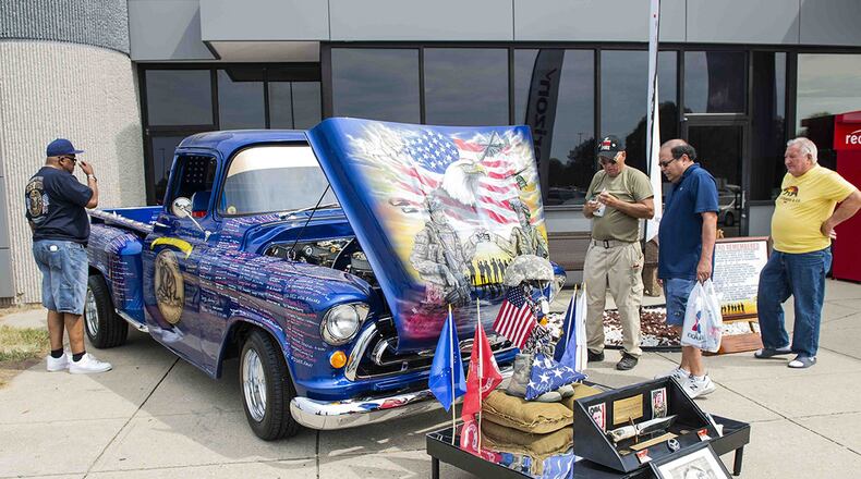 The Remembering Our Heroes ’57 Chevy 3200 Truck sits on display during its visit to the Wright-Patterson Air Force Base Exchange, Aug. 12. The truck is owned by retired Air Force Master. Sgt. Rick Breech and was built to be a rolling tribute to our nation’s fallen heroes from Operation Enduring Freedom and Operation Iraqi Freedom. (U.S. Air Force photo/Wesley Farnsworth)
