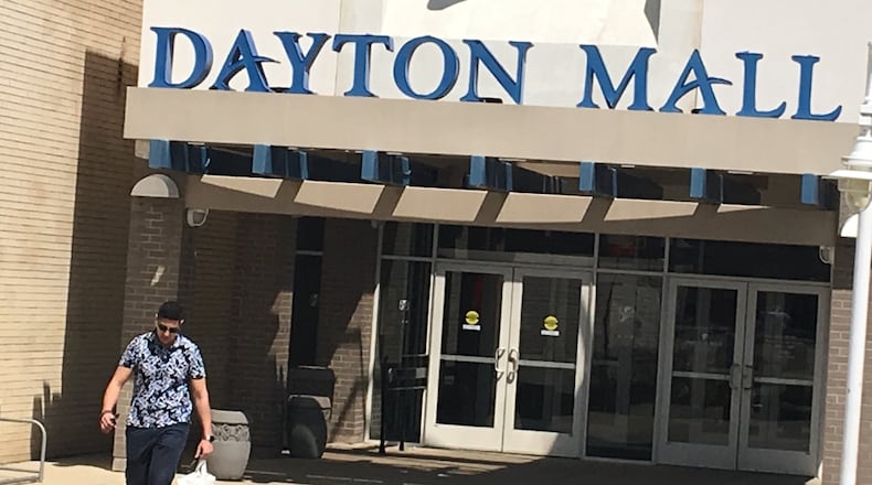 A shopper leave the Dayton Mall on a Sunday afternoon. Elder-Beerman, one of the mall’s anchor stores is scheduled to close. The mall already has plans in place to try to fill unused space as thousands of retail stores close nationwide.