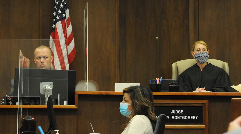 The Montgomery County Common Pleas Court suspended all jury trials for the rest of the year except in cases where unique and unavoidable circumstances are presented. Pictured is a jury trial from June where Montgomery County Common Pleas Court Judge Mary Montgomery presided over a jury trial while wearing a mask. MARSHALL GORBY\STAFF