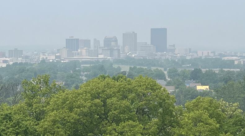 The downtown Dayton skyline is seen through a hazy smoke from Canadian wildfires on Wednesday, June 28, 2023. JEREMY P. KELLEY / STAFF