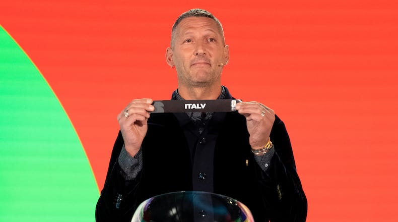Marco Materazzi draws Italy during the FIFA World Cup 2026 playoff draw in Zurich, Switzerland, Thursday, Nov. 20, 2025. (Claudio Thoma/Keystone via AP)