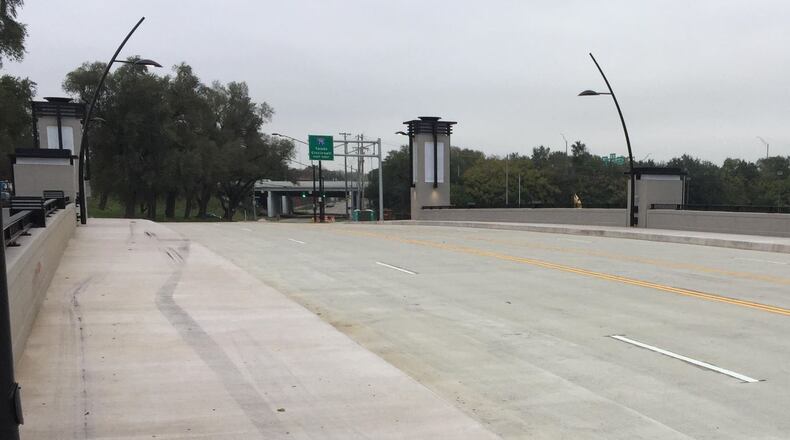 A car on Saturday morning, Nov. 4, 2017, went off the roadway and up a steep curb to the pathway on the brand-new Webster Street Bridge, within 48 hours of its opening Thursday night, Nov. 2, 2017, in Dayton.