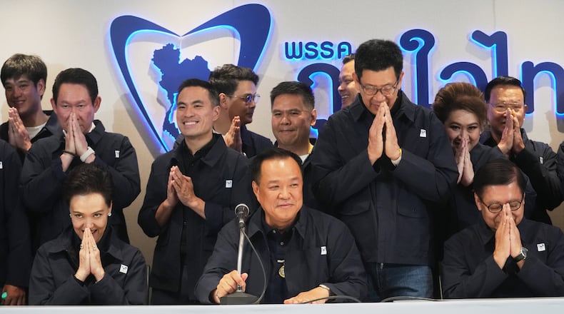 Thailand's Prime Minister and leader of Bhumjaithai Party Anutin Charnvirakul, center, speaks during a press conference at the party headquarters following the general election in Bangkok, Sunday, Feb. 8, 2026. (AP Photo/Sakchai Lalit)