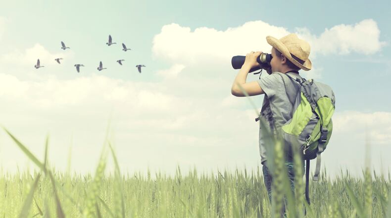 Birdwatching is an activity families can do together that will cost very little or is free. iSTOCK