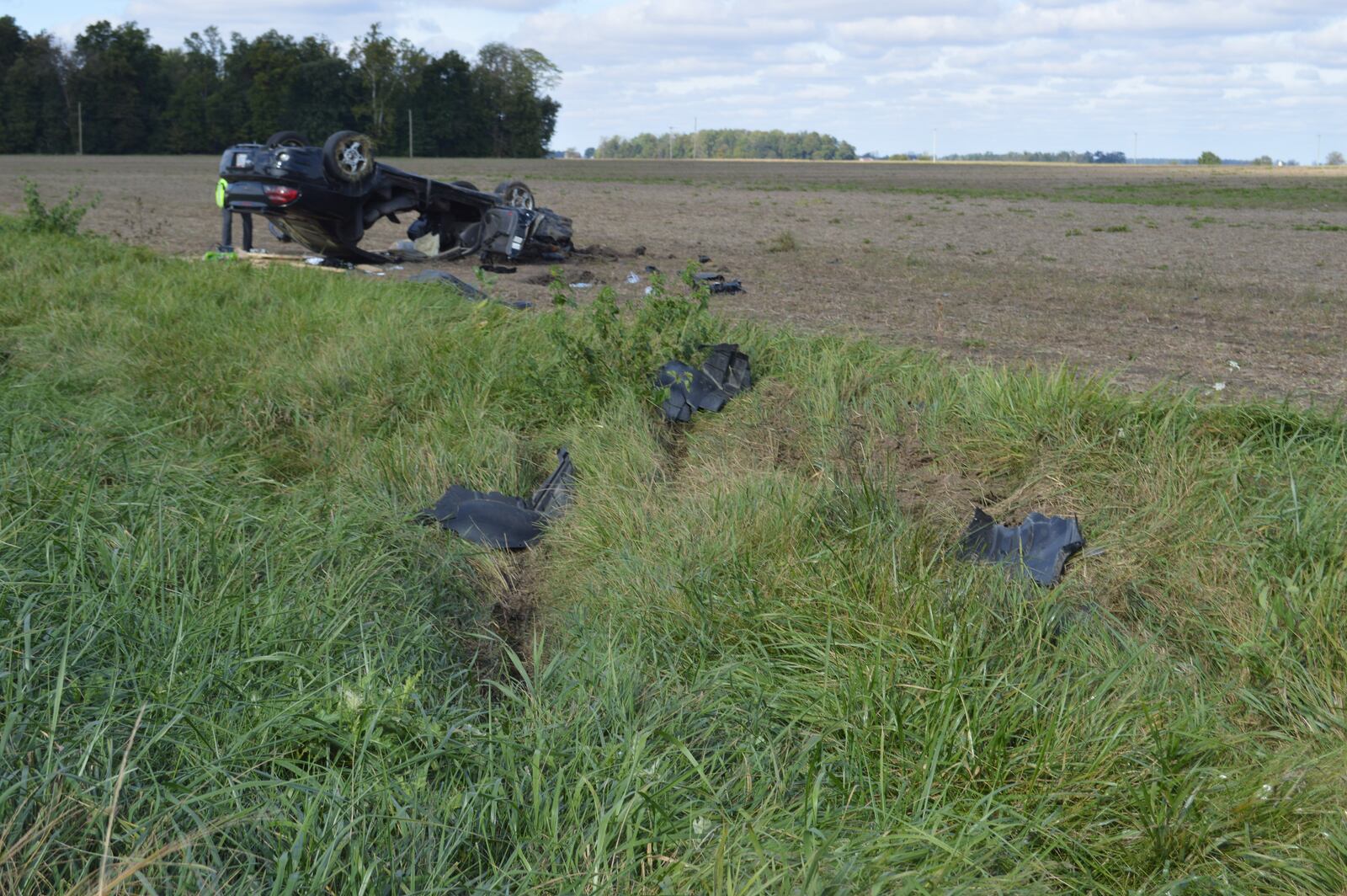 A Toledo man involved in a two-car crash Friday morning reportedly stole the car of a Good Samaritan who stopped at the scene to help. During a police chase, the man lost control of the stolen vehicle and crashed into a field on Ohio 707. Photo courtesy Mercer County Sheriff's Office.