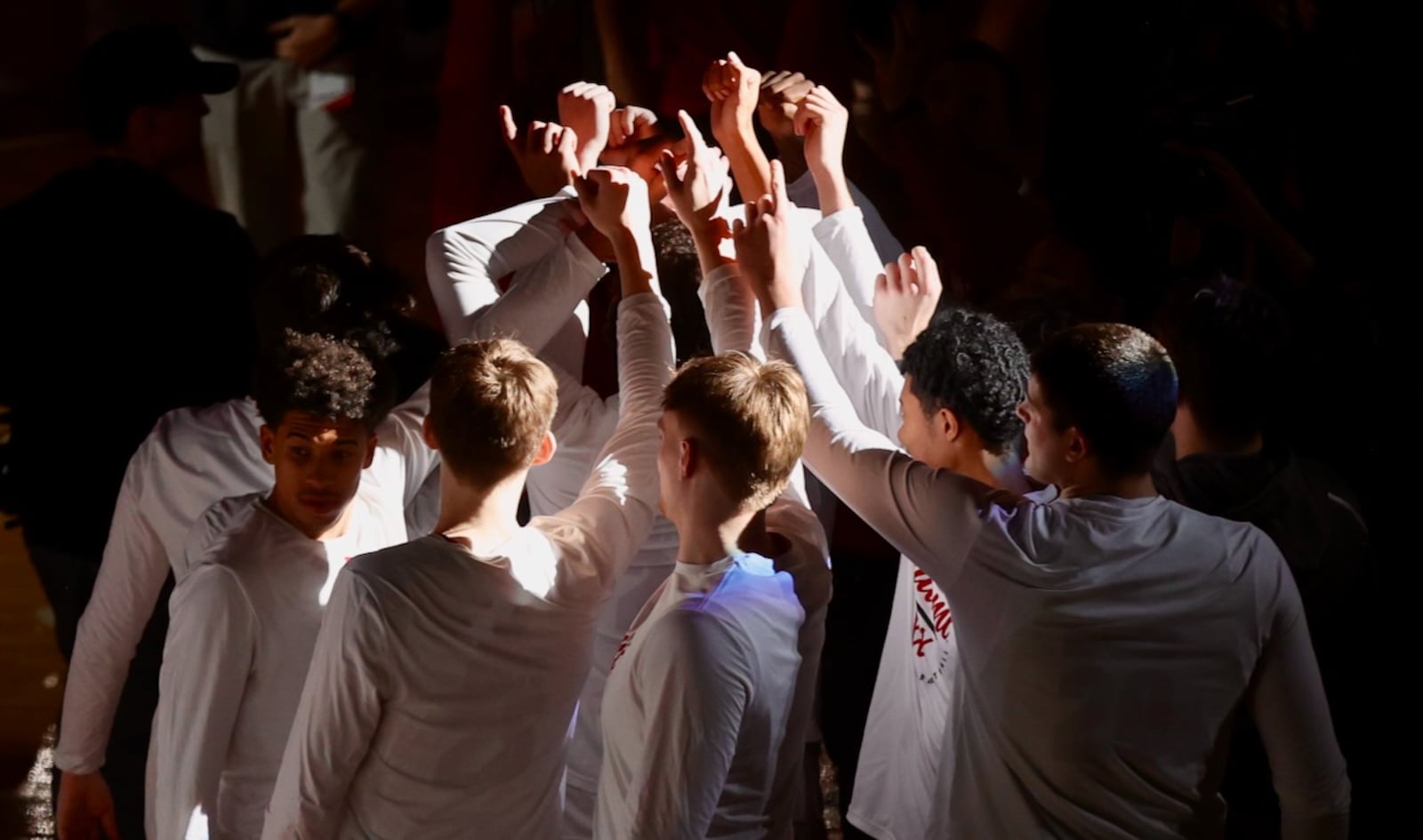 Miami huddles before a game against Ohio on Friday, Feb. 13, 2026, at Millett Hall in Oxford. David Jablonski/Staff