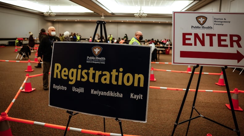 Around 500 people are registered to get their COVID-19 vaccine or booster at the Dayton Convention Center Wednesday Dec. 8, 2021. JIM NOELKER/STAFF