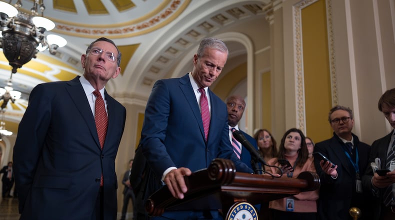 Senate Majority Leader John Thune, R-S.D., center, joined at left by Sen. John Barrasso, R-Wyo., the GOP whip, speaks to reporters at the Capitol in Washington, Tuesday, March 3, 2026. (AP Photo/J. Scott Applewhite)