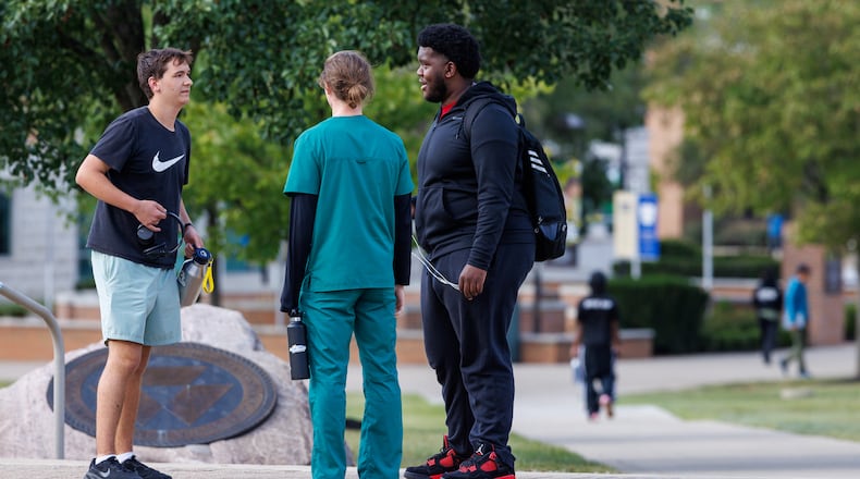 Wright State students talk on campus on Tuesday, Aug. 26. BRYANT BILLING / STAFF