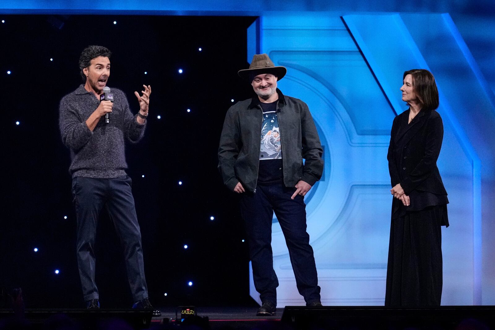 Film director Shawn Levy, left, speaks as director Dave Filoni and producer Kathleen Kennedy listen during a fan convention called the Star Wars Celebration in Chiba, near Tokyo, Friday, April 18, 2025. (AP Photo/Hiro Komae)
