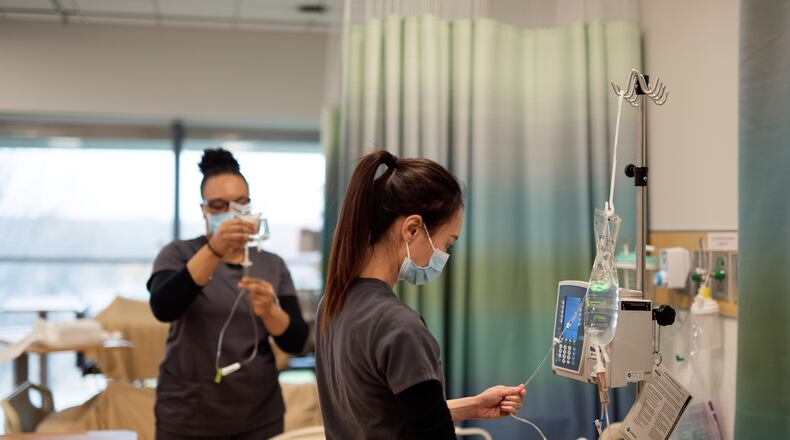 Sinclair nursing students practice medical care in a classroom setting. Photo courtesy of Sinclair Community College