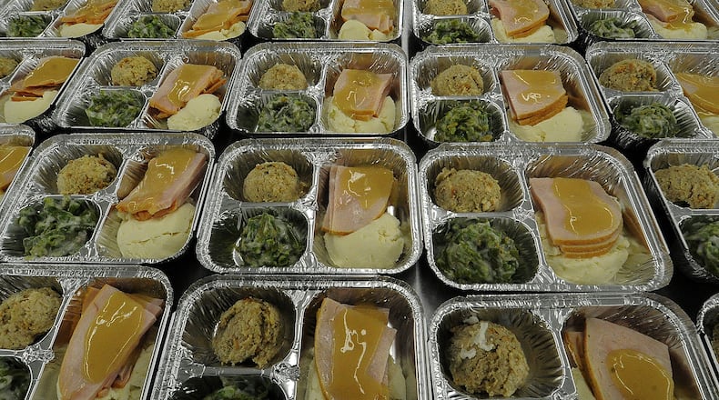 Miami Valley Meals prepares hundreds of Thankgiving meals Monday Nov. 21, 2022 for people in need. MARSHALL GORBY\STAFF