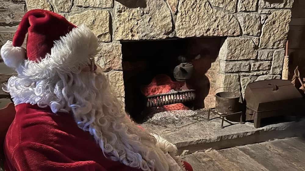 Visit with Santa by the fireplace in the Old Log House in Enon. CONTRIBUTED