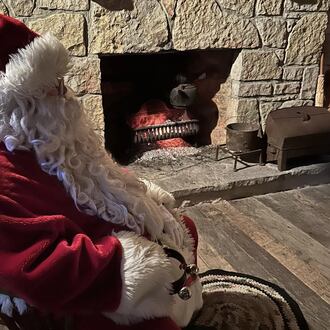 Visit with Santa by the fireplace in the Old Log House in Enon. CONTRIBUTED
