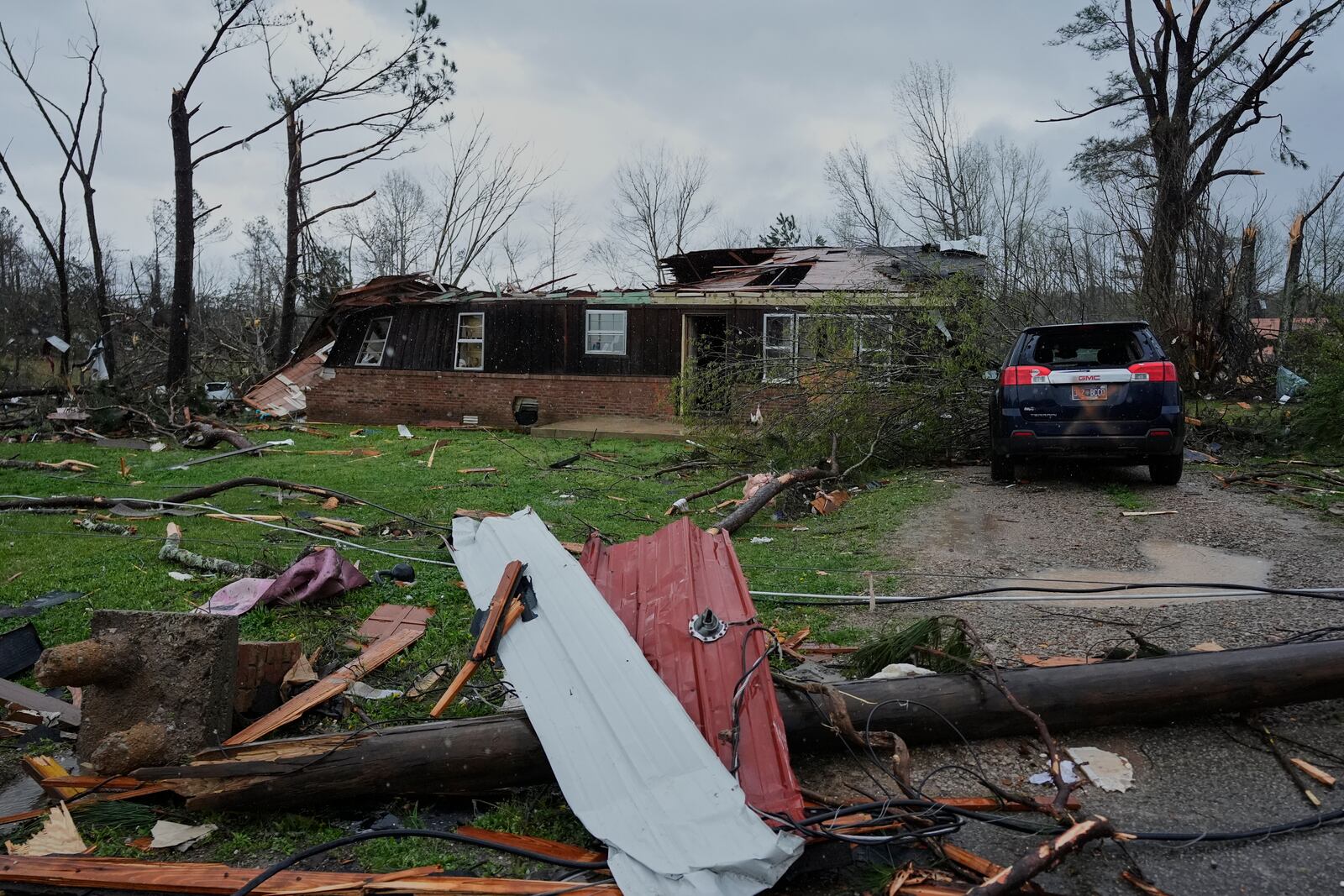 A Storm damaged home is seen Thursday, April 3, 2025, in Selmer, Tenn. (AP Photo/George Walker IV)