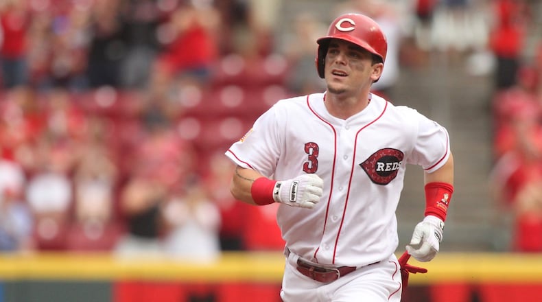 The Reds’ Scooter Gennett rounds the bases after a two-run home run against the White Sox on Tuesday, July 3, 2018, at Great American Ball Park in Cincinnati. David Jablonski/Staff