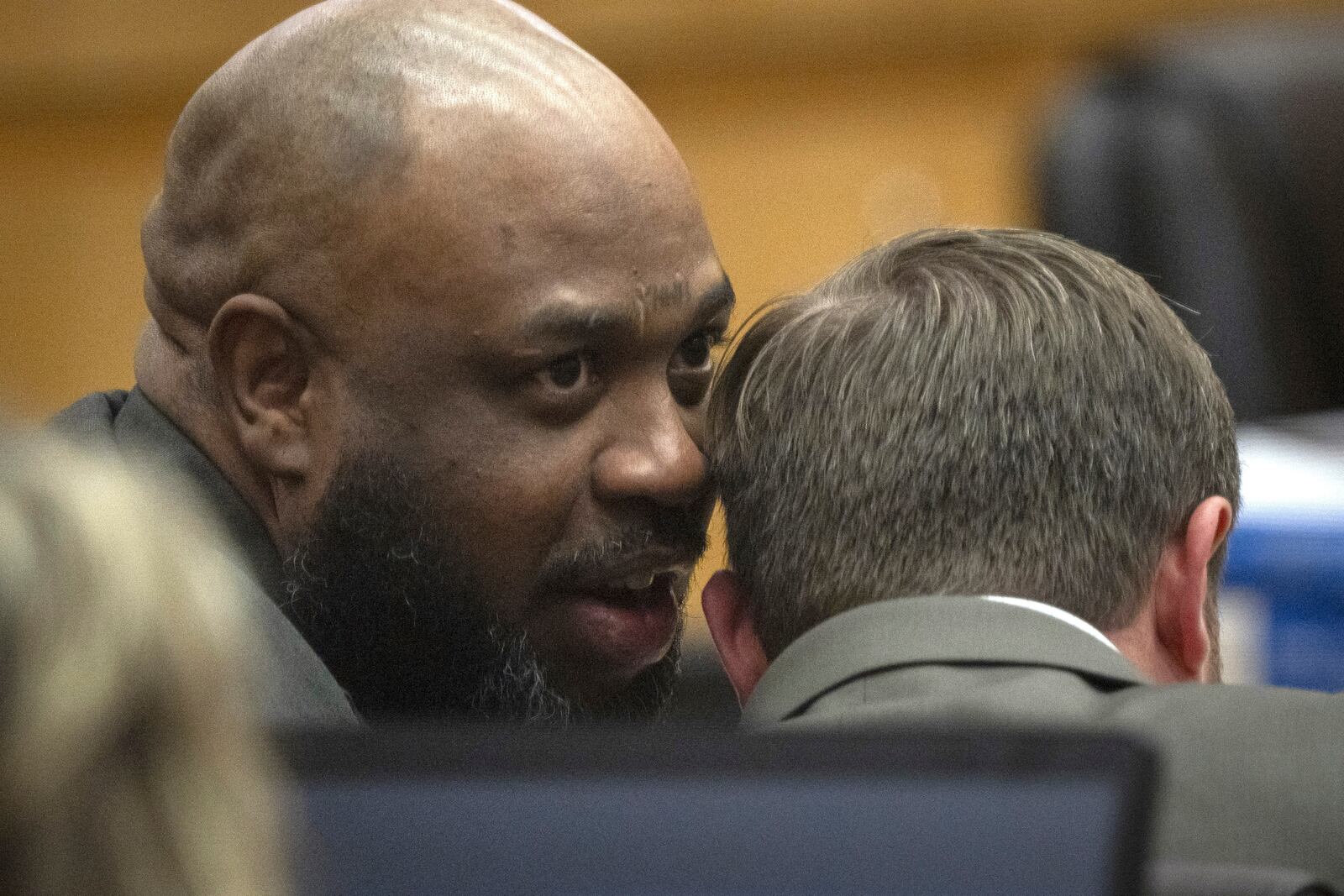 Cleophus Cooksey Jr., left, who is accused of killing eight people over a three-week span in late 2017, talks with attorney Adrian Little during his trial in Maricopa County Superior Court, Monday, May 5, 2025, in Phoenix. (Mark Henle/The Arizona Republic via AP, Pool)