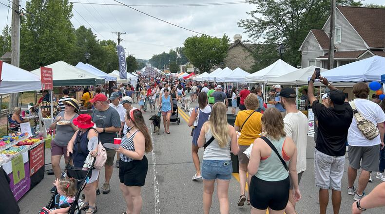 Participants of the Centerville-Washington Township Americana Festival in Centerville check out street vendors on July 4, 2024. The festival, which is the largest single-day event in Ohio, attracts over 85,000 visitors. STAFF FILE PHOTO