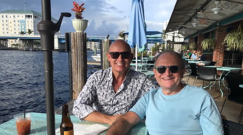 Bill Castro, left, co-owner of El Meson, with husband Mark Abbott, who is also the restaurant's special events chef.